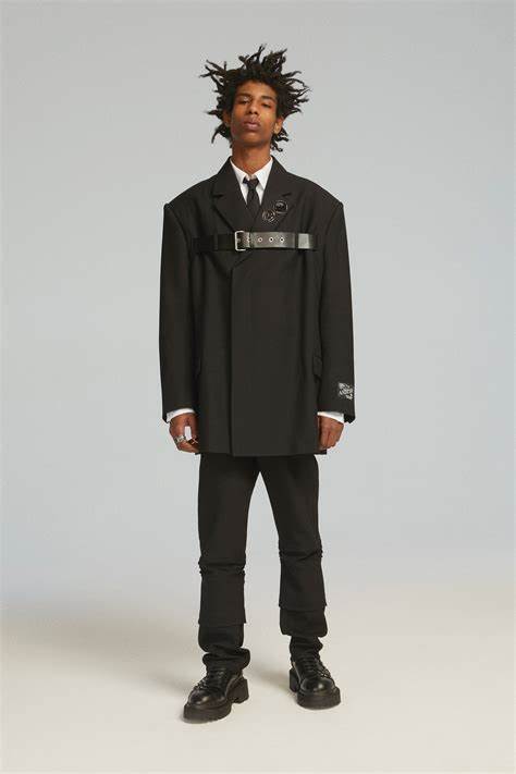 Corp-lore style image of a model showcasing an ensemble from Ambush FW23